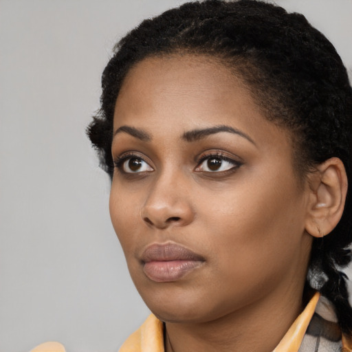Neutral black young-adult female with medium  black hair and brown eyes