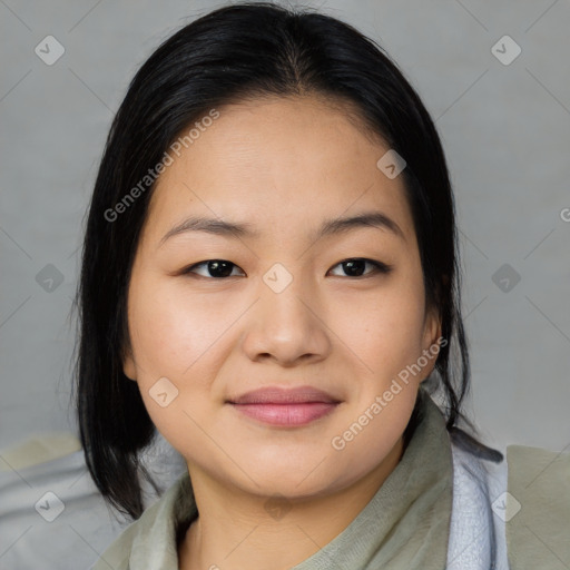 Joyful asian young-adult female with medium  black hair and brown eyes