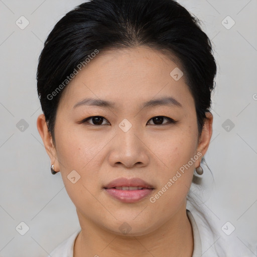 Joyful asian young-adult female with short  brown hair and brown eyes