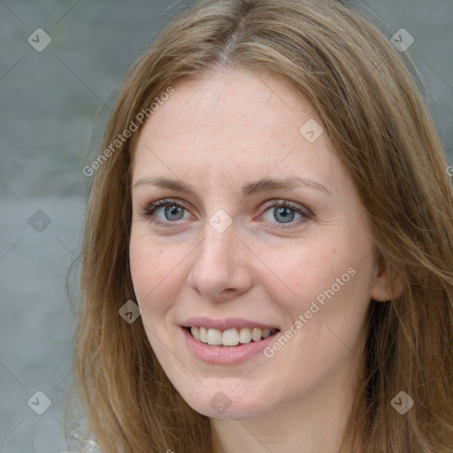 Joyful white adult female with long  brown hair and brown eyes