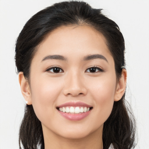 Joyful white young-adult female with long  brown hair and brown eyes