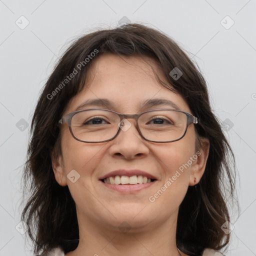 Joyful white adult female with medium  brown hair and grey eyes