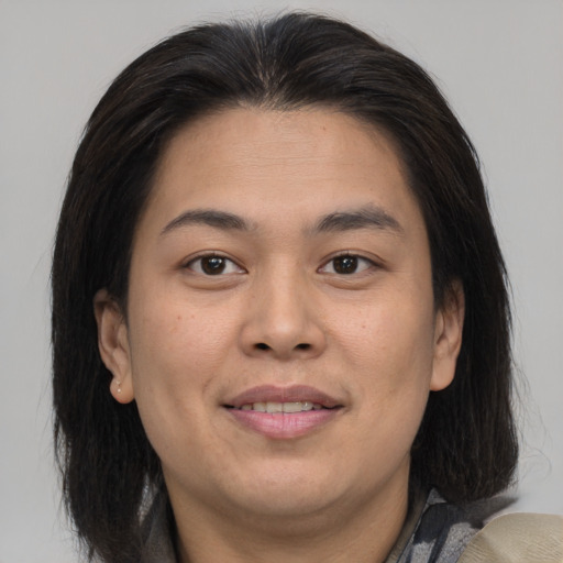 Joyful asian young-adult female with medium  brown hair and brown eyes