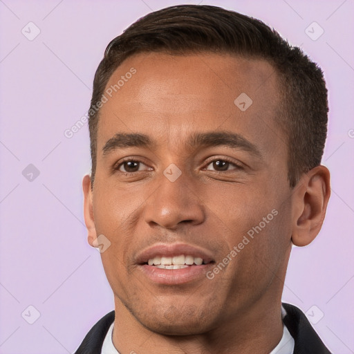 Joyful white young-adult male with short  brown hair and brown eyes