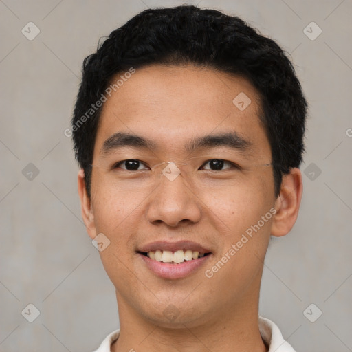 Joyful asian young-adult male with short  black hair and brown eyes