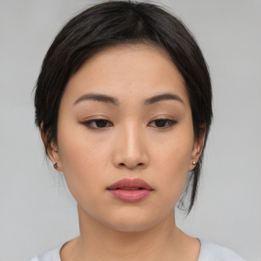 Neutral asian young-adult female with medium  black hair and brown eyes