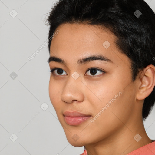 Joyful asian young-adult female with short  brown hair and brown eyes