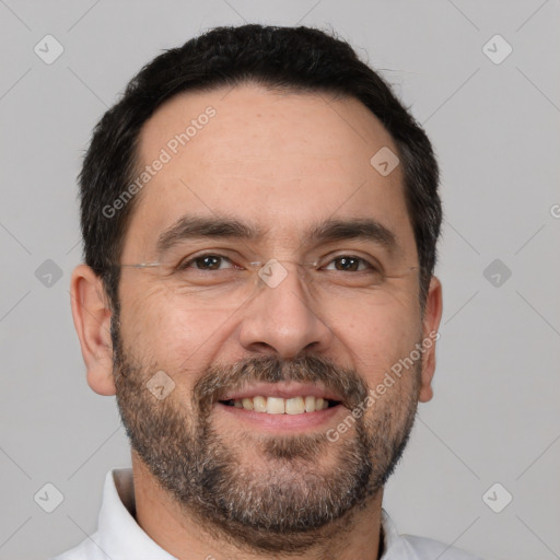 Joyful white adult male with short  brown hair and brown eyes