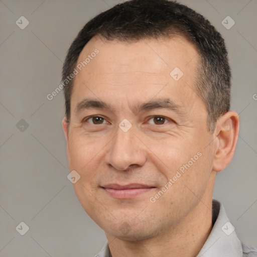 Joyful white adult male with short  brown hair and brown eyes