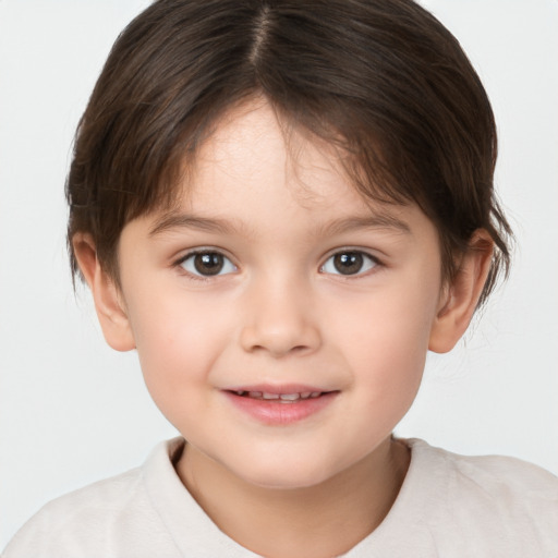 Joyful white child female with short  brown hair and brown eyes