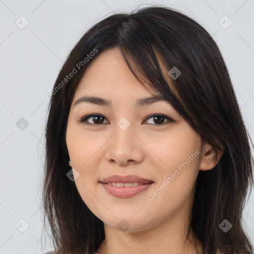 Joyful asian young-adult female with long  brown hair and brown eyes