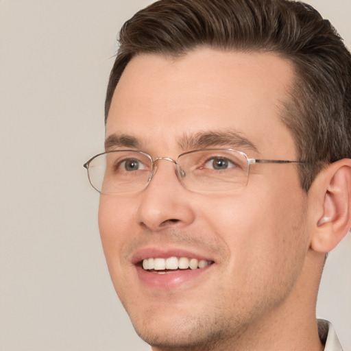 Joyful white adult male with short  brown hair and brown eyes