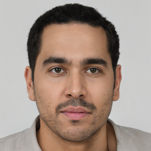 Neutral latino young-adult male with short  black hair and brown eyes