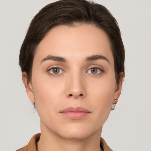 Neutral white young-adult female with short  brown hair and brown eyes