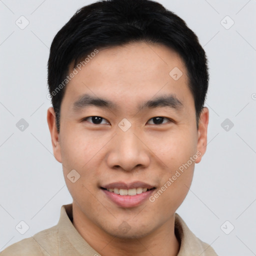 Joyful asian young-adult male with short  black hair and brown eyes