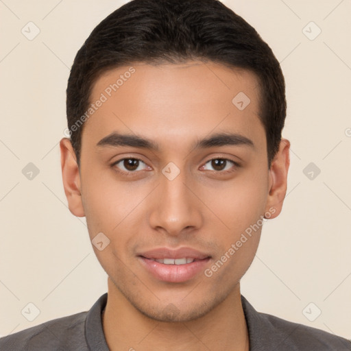 Joyful latino young-adult male with short  brown hair and brown eyes