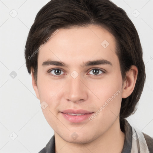 Joyful white young-adult male with medium  brown hair and brown eyes