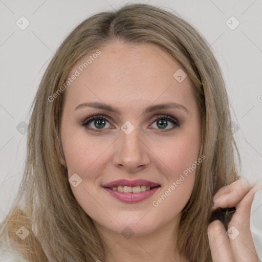 Joyful white young-adult female with long  brown hair and brown eyes