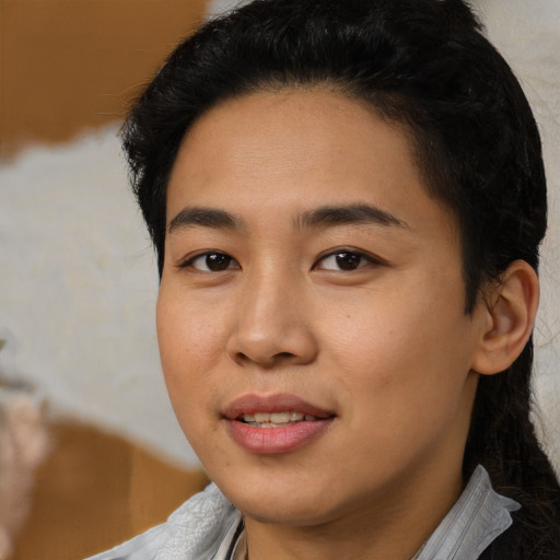 Joyful asian young-adult female with short  black hair and brown eyes