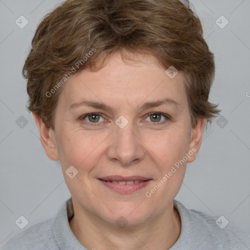 Joyful white adult female with short  brown hair and grey eyes