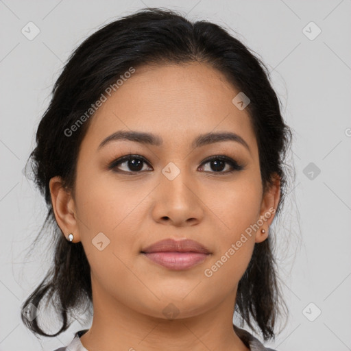 Joyful latino young-adult female with medium  brown hair and brown eyes