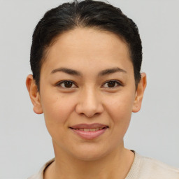 Joyful asian young-adult female with short  brown hair and brown eyes