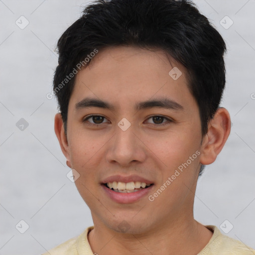Joyful asian young-adult male with short  brown hair and brown eyes