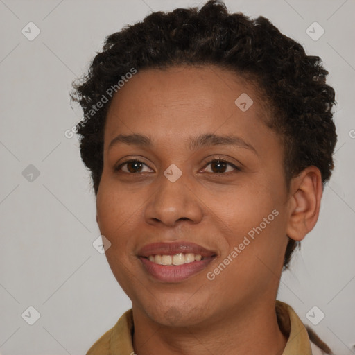 Joyful black young-adult female with short  brown hair and brown eyes