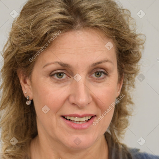 Joyful white adult female with medium  brown hair and green eyes