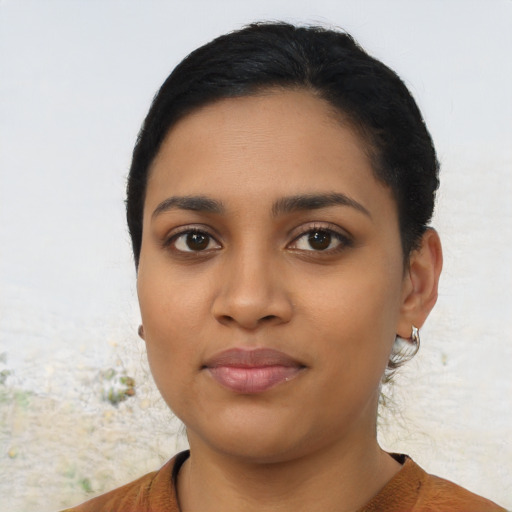 Neutral latino young-adult female with short  black hair and brown eyes