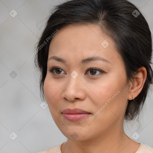 Joyful asian young-adult female with medium  brown hair and brown eyes