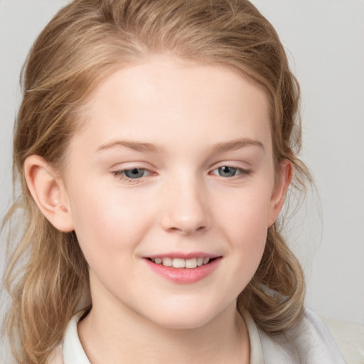 Joyful white child female with medium  brown hair and grey eyes