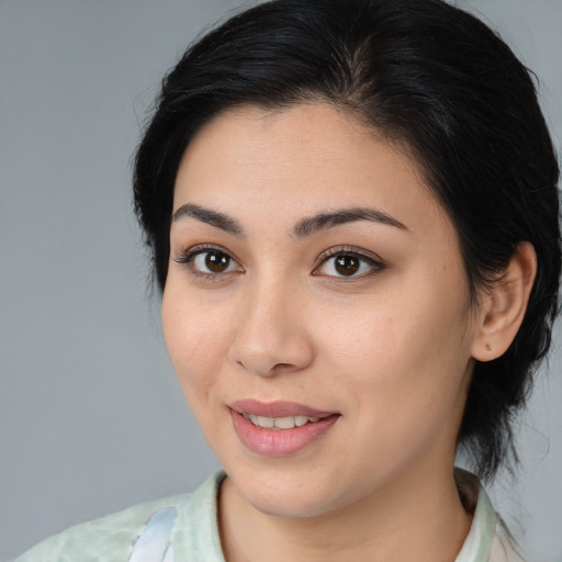 Joyful white young-adult female with medium  brown hair and brown eyes