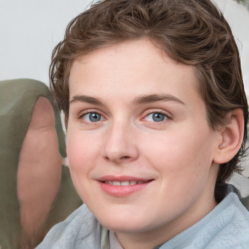 Joyful white young-adult female with medium  brown hair and blue eyes