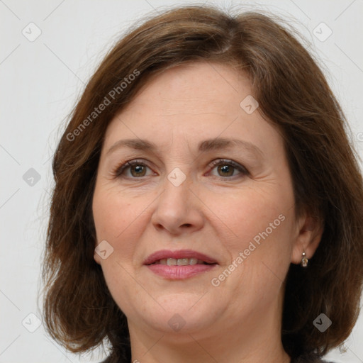 Joyful white adult female with medium  brown hair and grey eyes