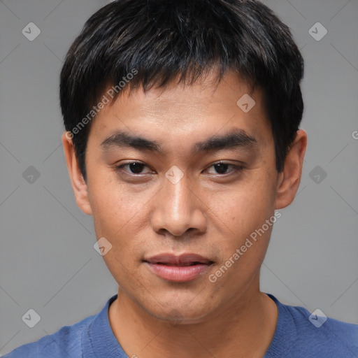 Joyful asian young-adult male with short  black hair and brown eyes