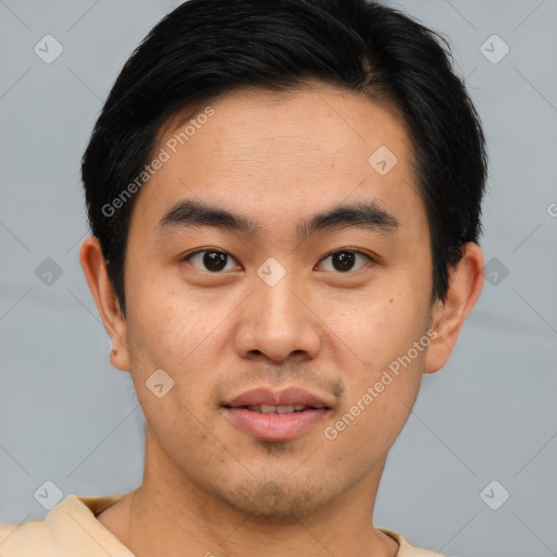 Joyful asian young-adult male with short  brown hair and brown eyes