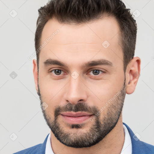 Neutral white young-adult male with short  brown hair and brown eyes