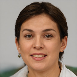 Joyful white adult female with short  brown hair and brown eyes