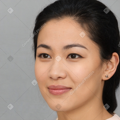 Joyful asian young-adult female with medium  brown hair and brown eyes