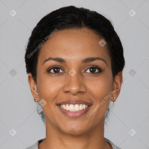 Joyful latino young-adult female with short  black hair and brown eyes