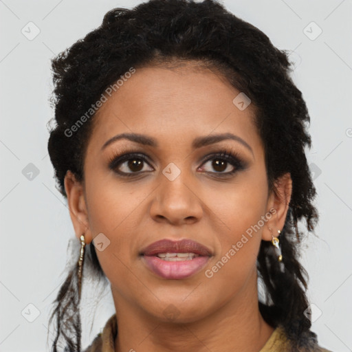 Joyful black young-adult female with long  brown hair and brown eyes