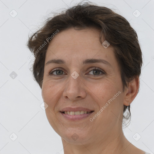 Joyful white adult female with short  brown hair and brown eyes