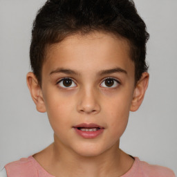 Joyful white child male with short  brown hair and brown eyes