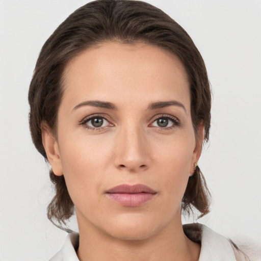 Neutral white young-adult female with medium  brown hair and brown eyes