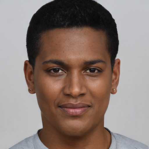 Joyful black young-adult male with short  black hair and brown eyes