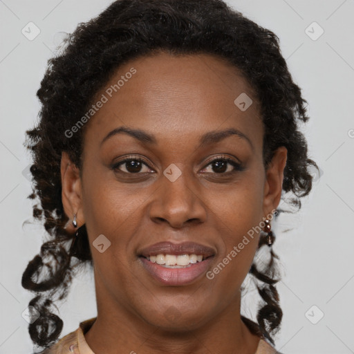 Joyful black adult female with short  brown hair and brown eyes