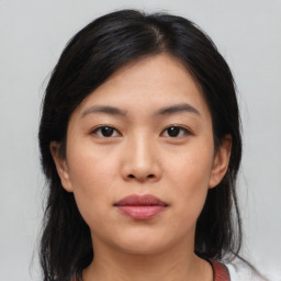 Neutral asian young-adult female with medium  brown hair and brown eyes