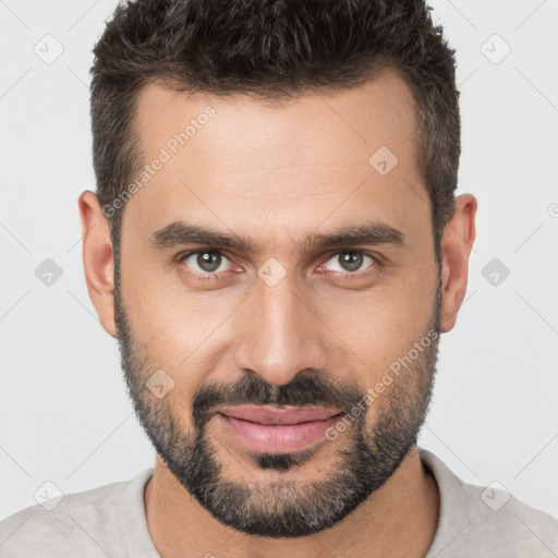 Joyful white young-adult male with short  brown hair and brown eyes