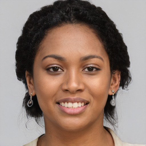 Joyful latino young-adult female with long  black hair and brown eyes